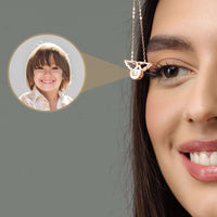 Thumbnail for Angel Photo Necklace featuring angel wings design, capturing cherished memories in a delicate accessory by Brother & Sisters.