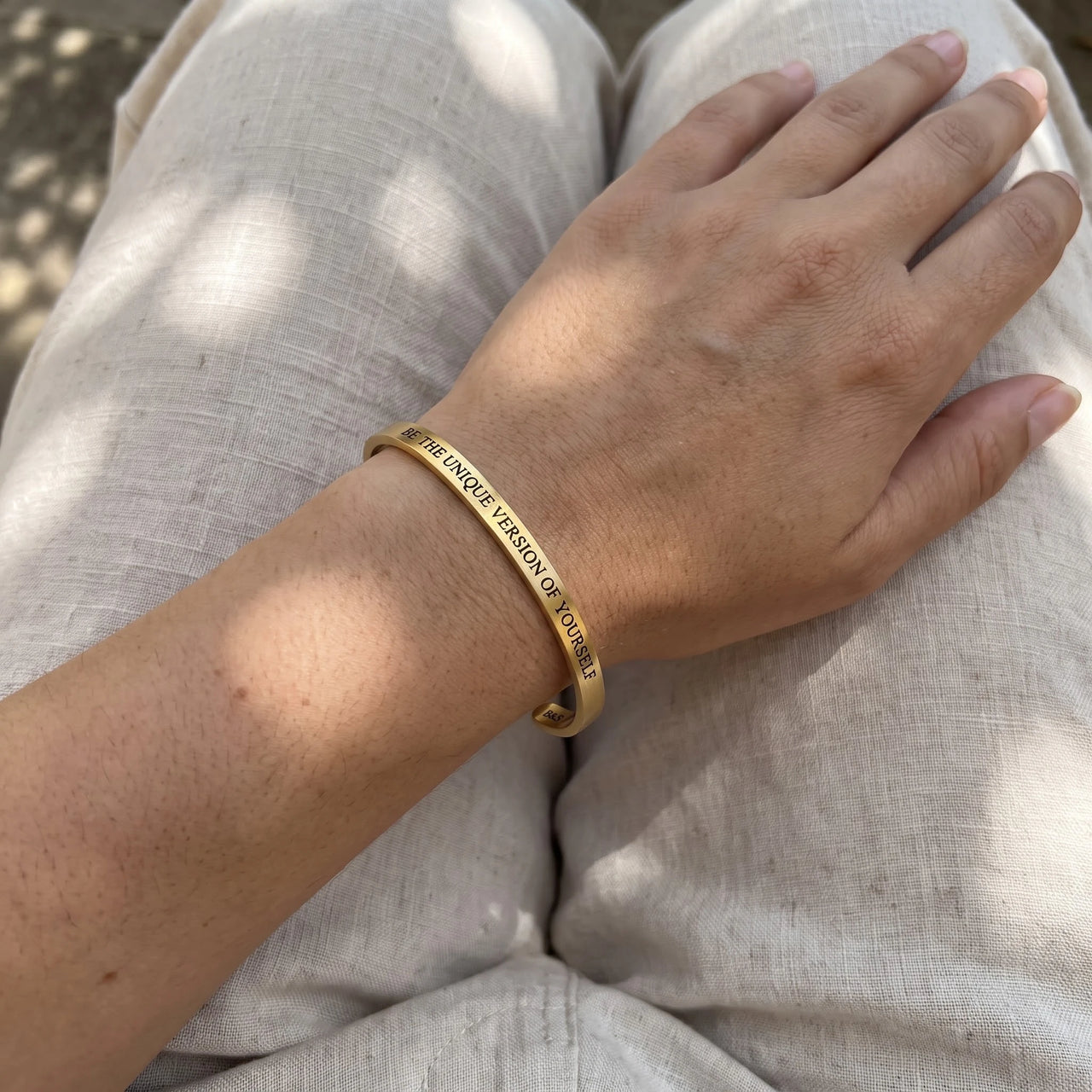 Be The Unique Version Of Yourself bracelet in gold worn, showing its real size | SKU: btuvoy-g