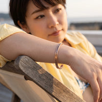 Thumbnail for Be The Unique Version Of Yourself bracelet in rose gold worn during a relaxed moment | SKU: btuvoy-rg