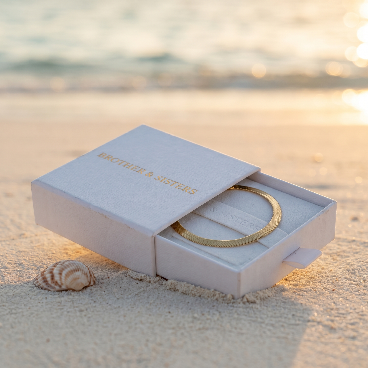 Herringbone Anklet in Brother & Sisters gift box on beach