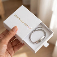 Thumbnail for Baby Name Bracelet by Brother & Sisters in silver gift box