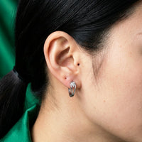 Thumbnail for Pear Crystal Huggie Hoops in Silver, close-up on the earlobe | SKU: 41007-silver