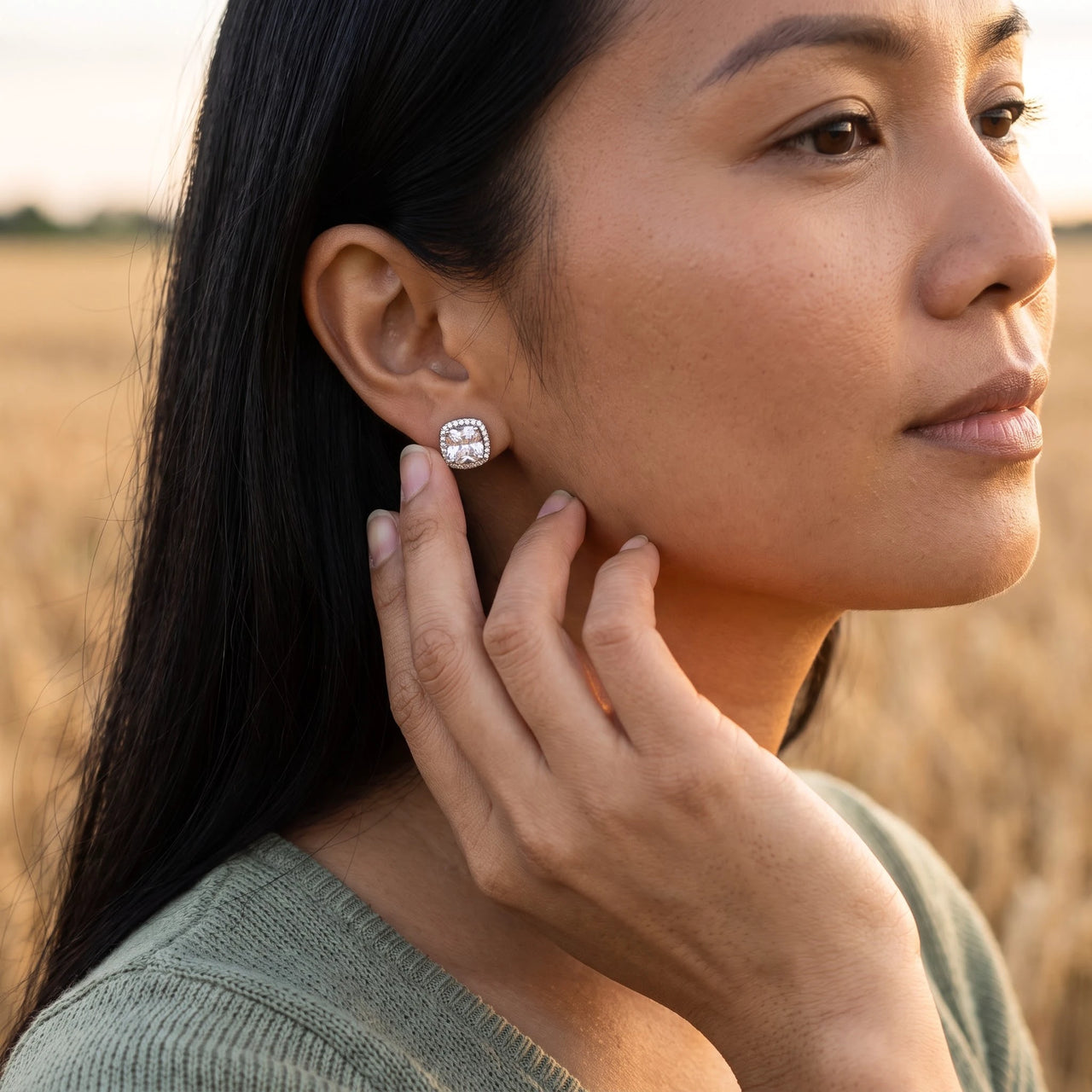 Woman gently touching her silver stud earrings | SKU: 505185-white